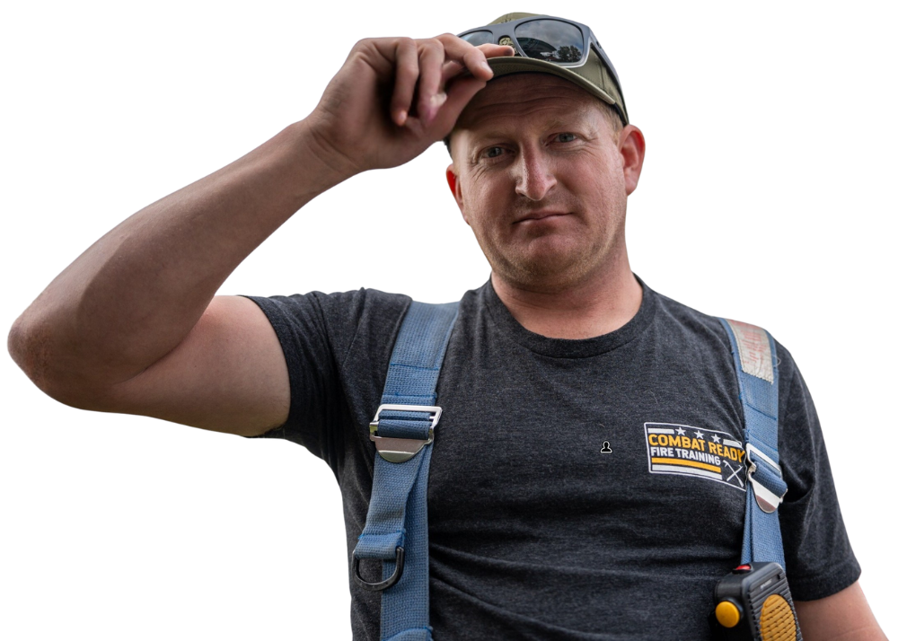 Combat Ready Fire instructor adjusts his cap while wearing turnout suspenders.
